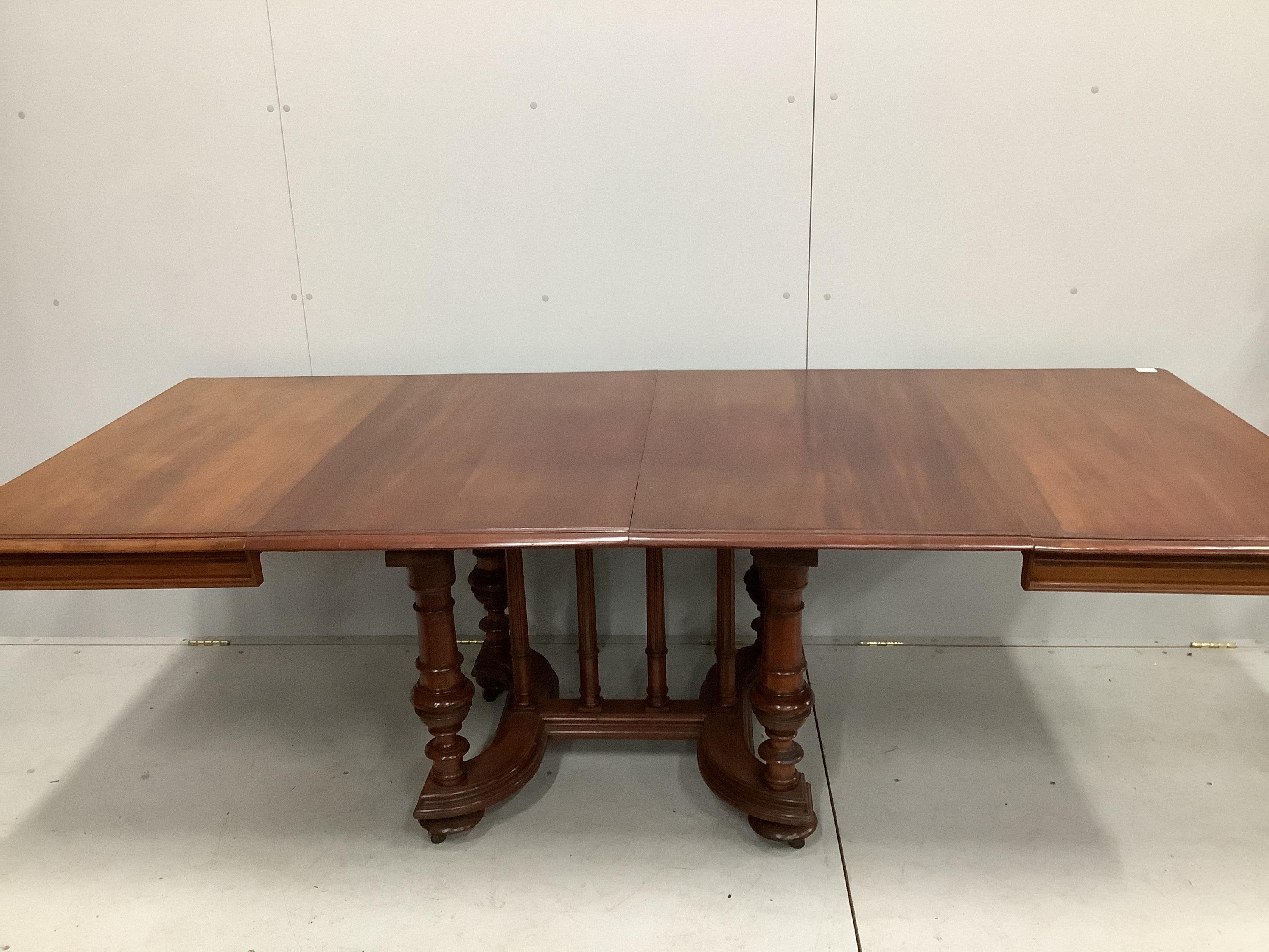 A 19th century and later French mahogany extending dining table, 232cm extended, two spare leaves, depth 104cm, height 74cm